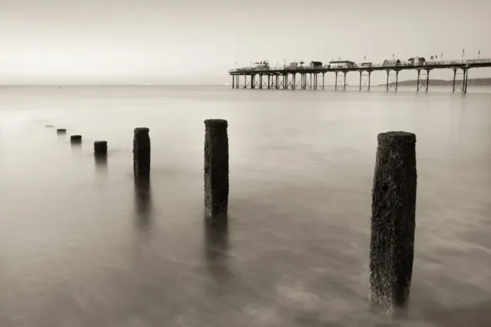 Framed Print : Teignmouth Pier and coastal defences at Teignmouth, South Devon, England. Summer