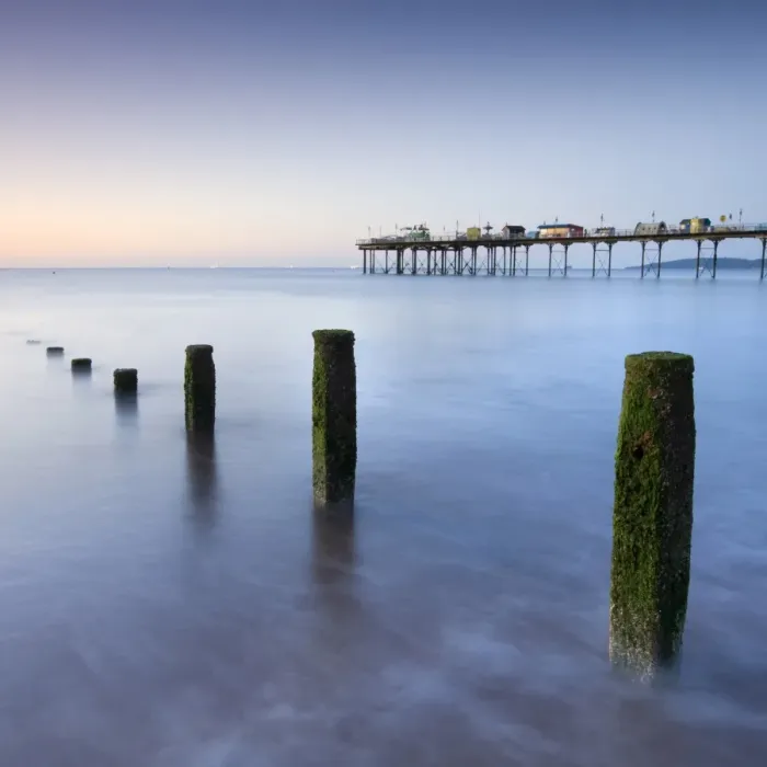 Framed Print : Teignmouth Pier and coastal defences at Teignmouth, South Devon, England. Summer Framed Print : Teignmouth Pier and coastal defences at Teignmouth, South Devon, England. Summer