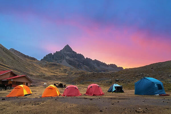 Tents in campground in Andean mountains near Rainbow mountain at sunset, near Uchullujllo, Pitumarca District, Canchis Province, Cuzco Region, Peru