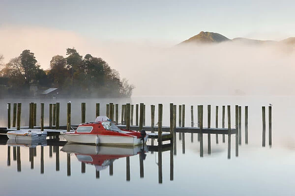 Tethered boats on Derwent Water on a misty morning, Lake District National Park, Cumbria