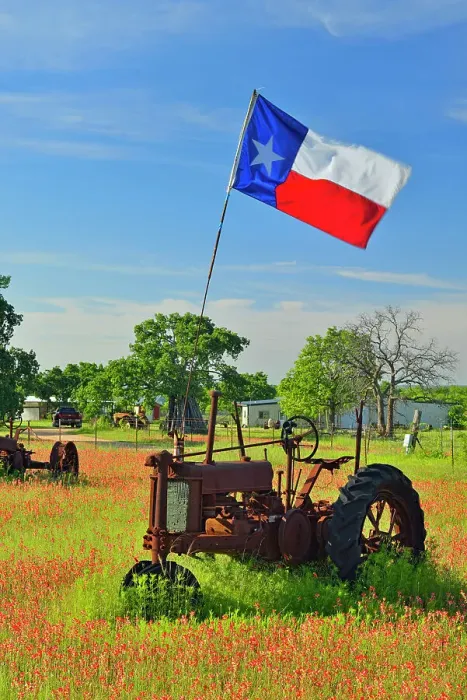 Framed Print : Texas flag on a 1935 John Deer tractor in a field of paintbrush, Burnet County, Texas, USA Framed Print : Texas flag on a 1935 John Deer tractor in a field of paintbrush, Burnet County, Texas, USA