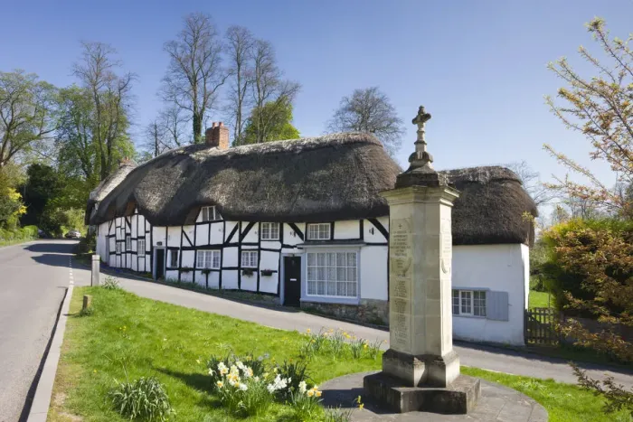 Framed Print : Thatched cottages and war memorial in the village of Wherwell, Hampshire, England Framed Print : Thatched cottages and war memorial in the village of Wherwell, Hampshire, England