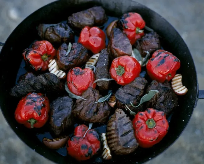 Framed Print : Thick steaks and whole red peppers cooked on an open fire at Kwandwe Lodge Framed Print : Thick steaks and whole red peppers cooked on an open fire at Kwandwe Lodge