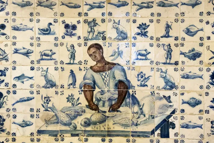 Framed Print : Tiles representing a black woman preparing fish Framed Print : Tiles representing a black woman preparing fish