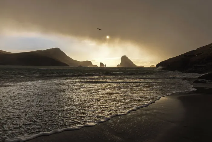 Framed Print : Tindholmur islet and Drangarnir sea stacks seen from the beach of Bour. Island of Vagar. Faroe Islands