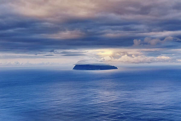 The tiny and imposing inhabited island of Corvo in the middle of the Atlantic Ocean. Azores archipelago, Portugal
