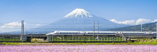 Tokaido Shinkansen bullet train passing by Mount Fuji, Yoshiwara, Shizuoka prefecture