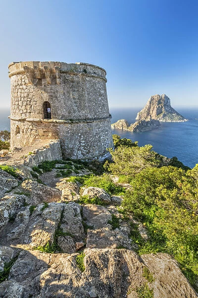 Torre des Savinar defence tower with Es Vedra island in the background, Ibiza
