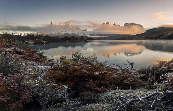 Torres del Paine mountain range at sunrise with fog, Patagonia, Chile
