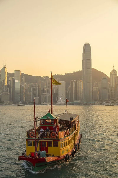 Tour boat in Victoria Harbour at sunset, Hong Kong Island, Hong Kong