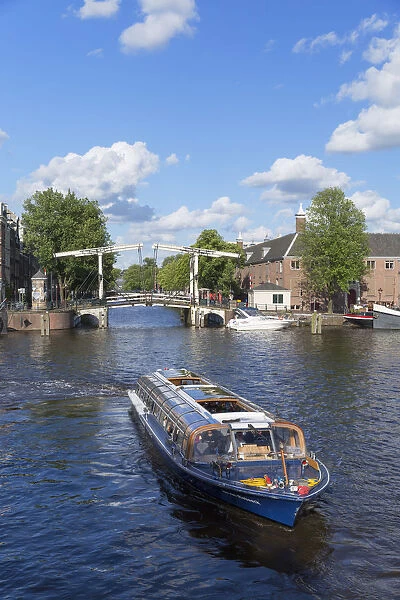 Tourist boat on Amstel River, Amsterdam, Netherlands