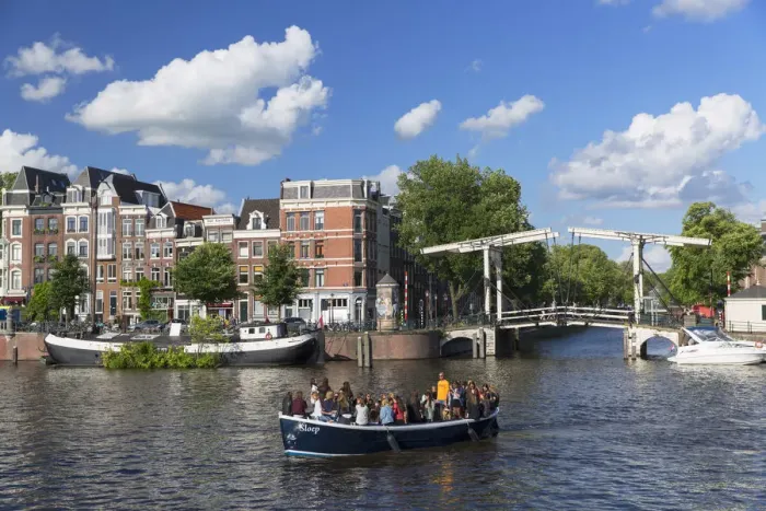 Framed Print : Tourist boat on Amstel River, Amsterdam, Netherlands Framed Print : Tourist boat on Amstel River, Amsterdam, Netherlands