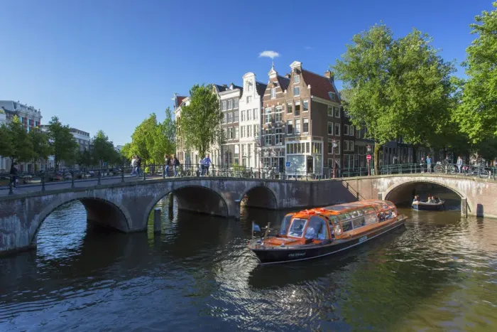 Framed Print : Tourist boats on Prinsengracht canal, Amsterdam, Netherlands Framed Print : Tourist boats on Prinsengracht canal, Amsterdam, Netherlands