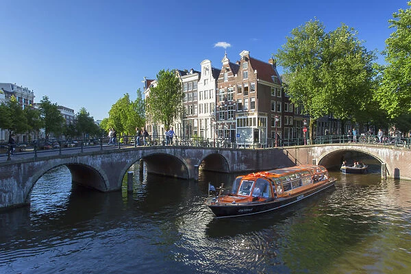 Tourist boats on Prinsengracht canal, Amsterdam, Netherlands