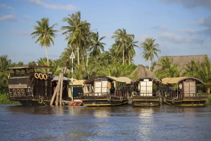 Framed Print : Tourist boats at resort on Ben Tre River, Ben Tre, Mekong Delta, Vietnam Framed Print : Tourist boats at resort on Ben Tre River, Ben Tre, Mekong Delta, Vietnam