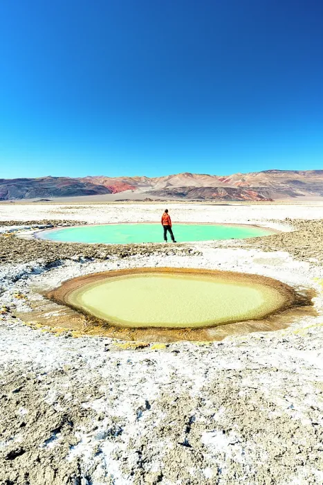 Framed Print : Tourist on the edge of colorful lagoons, Ojos del Campo, Salar de Antofalla, Puna, Catamarca, Argentina. (MR) Framed Print : Tourist on the edge of colorful lagoons, Ojos del Campo, Salar de Antofalla, Puna, Catamarca, Argentina. (MR)