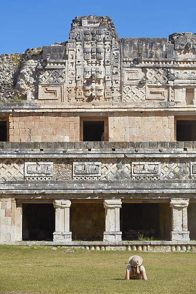 A tourist looking at the ancient Mayan town of Uxmal, Yucatan, Mexico. The ruins of Uxmal have been declared a UNESCO World Heritage Site in 1996. (MR)