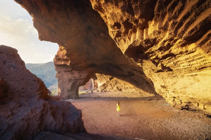 Framed Print : A tourist observes Cueva Roja at sunset, Santa Cruz de Tenerife, Tenerife, Canary Islands, Spain