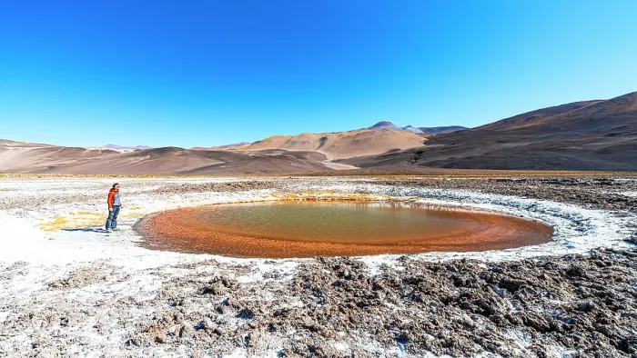 Framed Print : Tourist observing a salt pond, Ojos del Campo, Salar de Antofalla, Puna, Catamarca, Argentina. (MR) Framed Print : Tourist observing a salt pond, Ojos del Campo, Salar de Antofalla, Puna, Catamarca, Argentina. (MR)