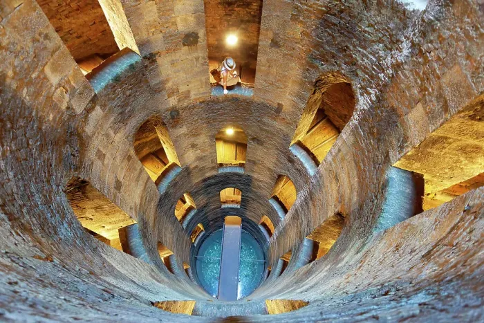 Framed Print : A tourist in St. Patrick's Well (Pozzo di San Patrizio), a historic well in Orvieto, Terni province, Umbria region, Italy. (MR) Framed Print : A tourist in St. Patrick's Well (Pozzo di San Patrizio), a historic well in Orvieto, Terni province, Umbria region, Italy. (MR)