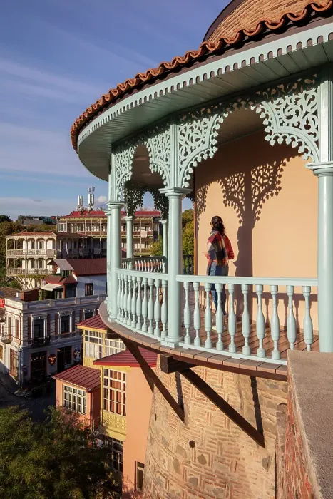 Framed Print : A tourist stands on the blue balcony of the Queen Darejan's Palace, Tbilisi, Georgia Framed Print : A tourist stands on the blue balcony of the Queen Darejan's Palace, Tbilisi, Georgia