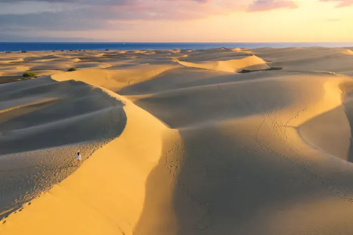 Framed Print : Tourist walking on sand dunes at sunset. Maspalomas, Las Palmas, Gran Canaria Framed Print : Tourist walking on sand dunes at sunset. Maspalomas, Las Palmas, Gran Canaria