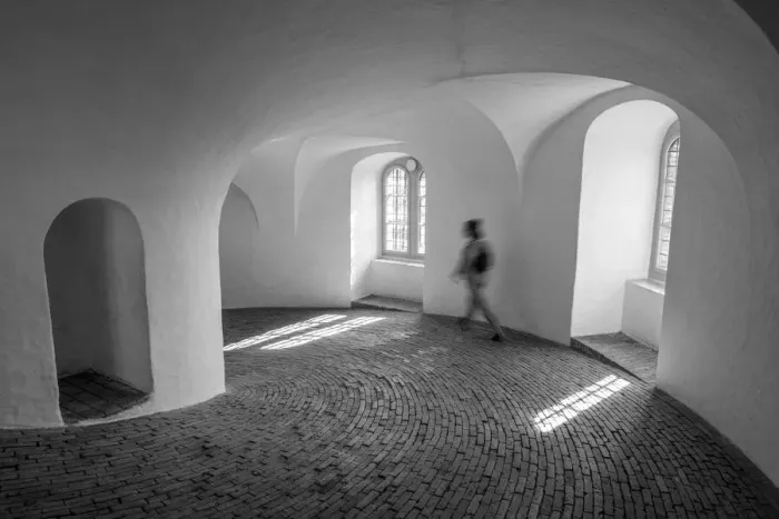 Framed Print : A tourist walks down the equestrian staircase (riders staircase)