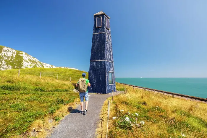 Framed Print : A tourist walks at Samphire Hoe solar towerhouse, Samphire Hoe, Dover, Kent, England, United Kingdom (MR) Framed Print : A tourist walks at Samphire Hoe solar towerhouse, Samphire Hoe, Dover, Kent, England, United Kingdom (MR)