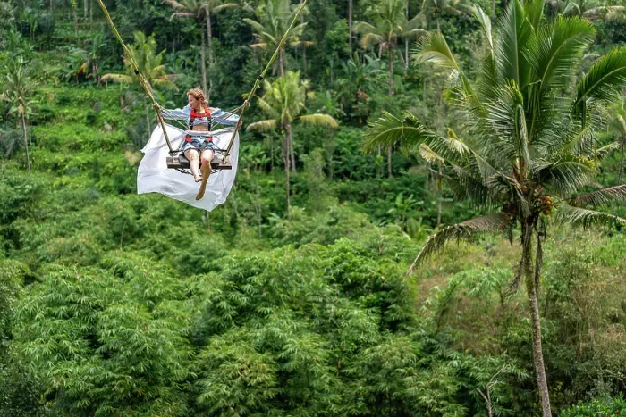 Framed Print : Tourist woman swinging over the Balinese tropical forest, Ubud, Indonesia Framed Print : Tourist woman swinging over the Balinese tropical forest, Ubud, Indonesia