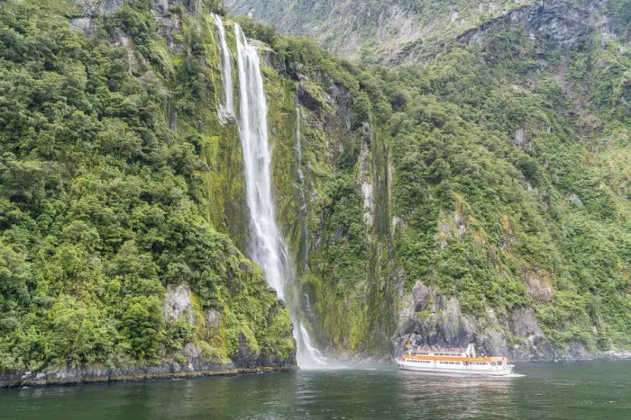 Framed Print : Touristic boat facing Stirling Falls in Milford Sound. Fiordland NP, Southland district Framed Print : Touristic boat facing Stirling Falls in Milford Sound. Fiordland NP, Southland district