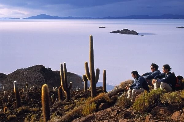 Tourists enjoy the view from the top of Isla de Pescado