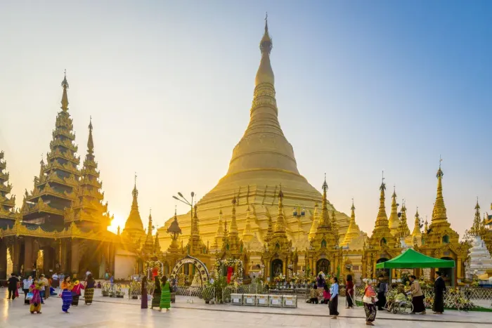Framed Print : Tourists at gilded Shwedagon Pagoda against clear sky at sunrise, Yangon, Yangon Region