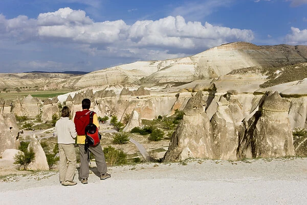 Tourists looking over Volcanic tufa formations, (Fairy Chimneys), Pasabag, near Zelve