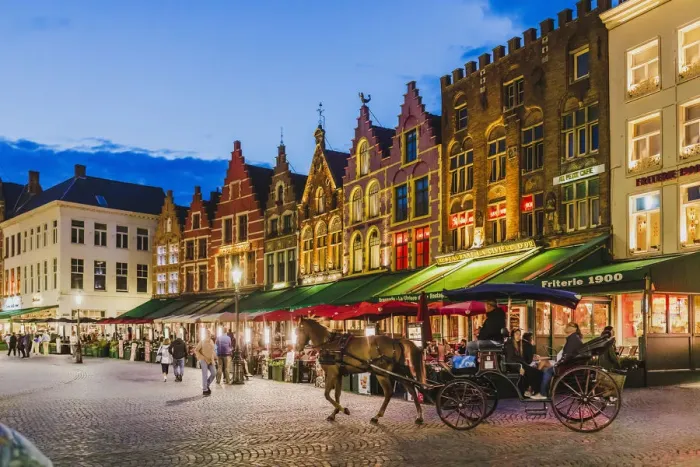 Framed Print : Tourists sitting in cafe on Bruges main square, Belgium