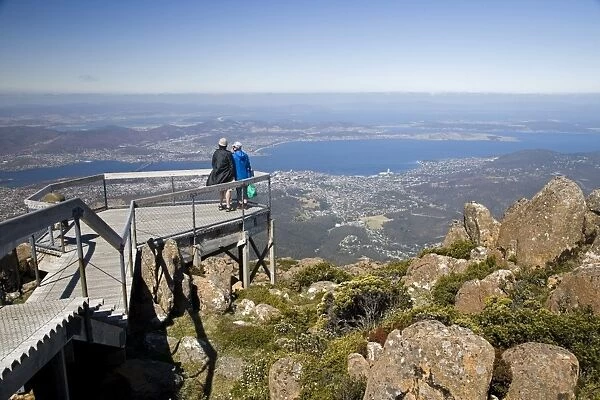 Tourists take in the spectaular view of Hobart from