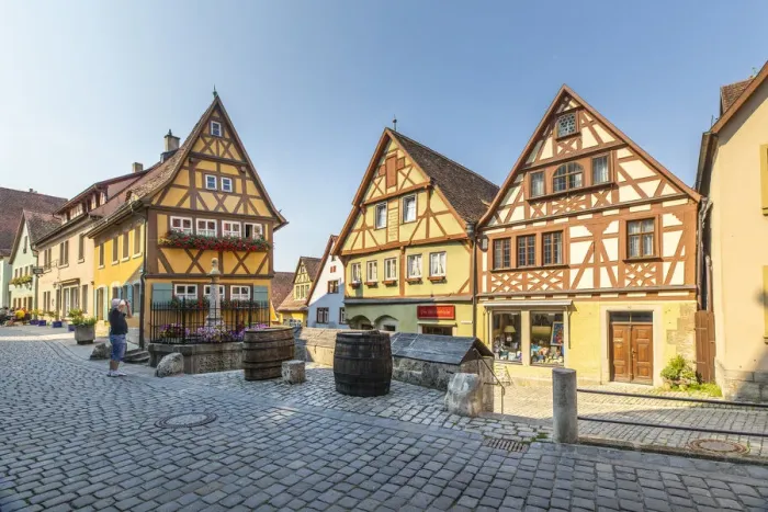 Framed Print : Tourists on Spitalgasse street with Plonlein half-timbered buildings Framed Print : Tourists on Spitalgasse street with Plonlein half-timbered buildings