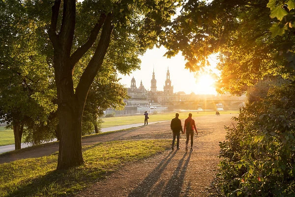 Tourists walk along the Elbe riverside in Dresden, Saxony, Germany