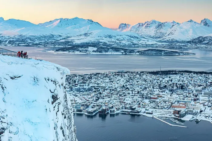 Framed Print : Tourists watching sunset over the frozen sea and snowy city of Tromso from Fjellheisen viewpoint on top of a mountain, Norway Framed Print : Tourists watching sunset over the frozen sea and snowy city of Tromso from Fjellheisen viewpoint on top of a mountain, Norway