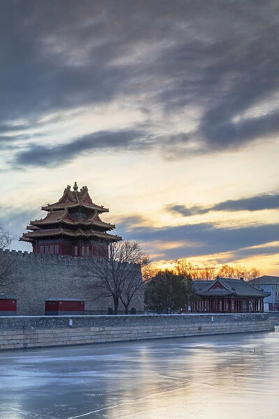 Tower and moat of Forbidden City at sunset, Beijing, China