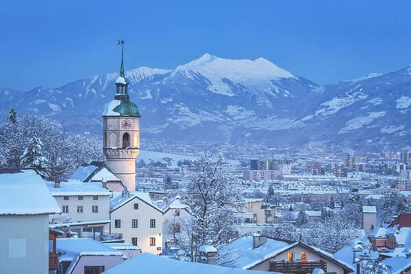The tower of the old parish church of H√∂tting on a cold freezing evening, Innsbruck, Tyrol, Austria