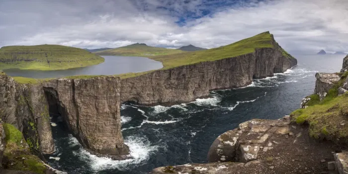 Framed Print : Towering sea cliffs on the island of Vagar in the Faroe Islands, Denmark. Summer Framed Print : Towering sea cliffs on the island of Vagar in the Faroe Islands, Denmark. Summer