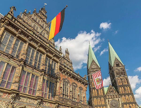 Town hall with Germany and Bremen flag in front of St. Petri Cathedral on the market square, Bremen, Germany