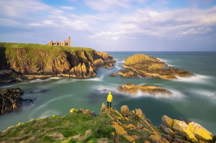 Framed Print : A tpurist observes Slains Castle at sunset, Cruden Bay, Aberdeenshire, Scotland, United Kingdom Framed Print : A tpurist observes Slains Castle at sunset, Cruden Bay, Aberdeenshire, Scotland, United Kingdom