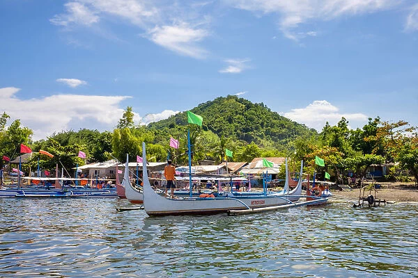 Traditional Bangka boats docked on on the shore of Taal Lake on Taal Volcano Island