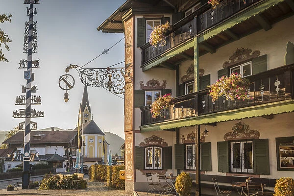 Traditional Bavarian inn and maypole in Schliersee, Upper Bavaria, Bavaria, Germany