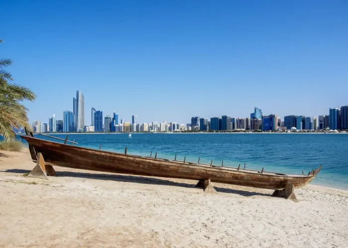 Framed Print : Traditional boat in the Heritage Village with city skyline in the background, Abu Dhabi Framed Print : Traditional boat in the Heritage Village with city skyline in the background, Abu Dhabi