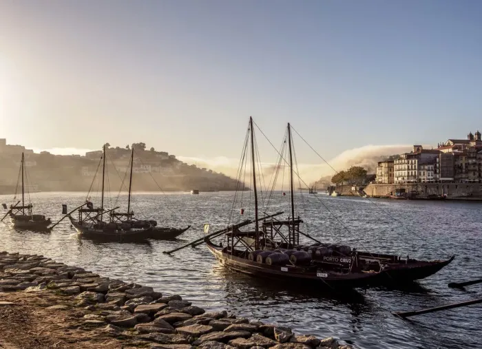Framed Print : Traditional boats on Vila Nova de Gaia bank of Douro River, Porto Skyline in Framed Print : Traditional boats on Vila Nova de Gaia bank of Douro River, Porto Skyline in