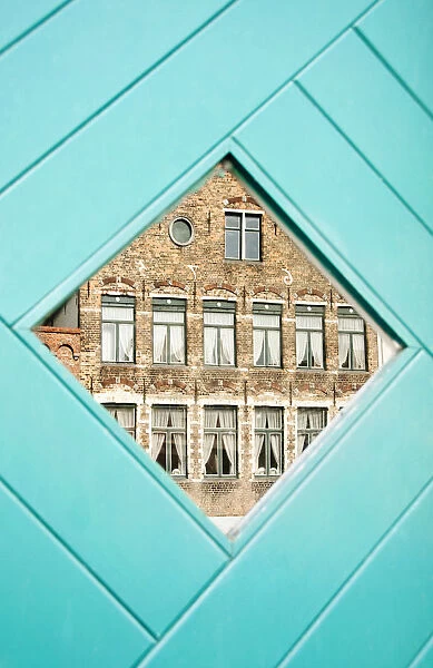 Traditional building reflected in the window, Bruges, Belgium