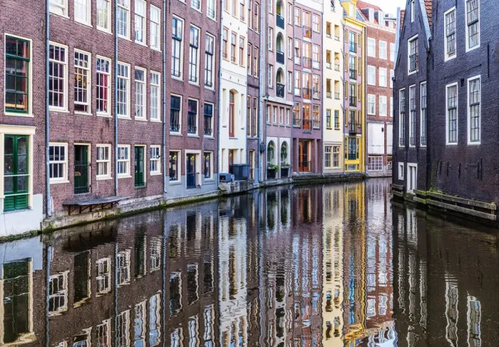Framed Print : Traditional buildings reflected in the canal, Amsterdam, the Netherlands Framed Print : Traditional buildings reflected in the canal, Amsterdam, the Netherlands