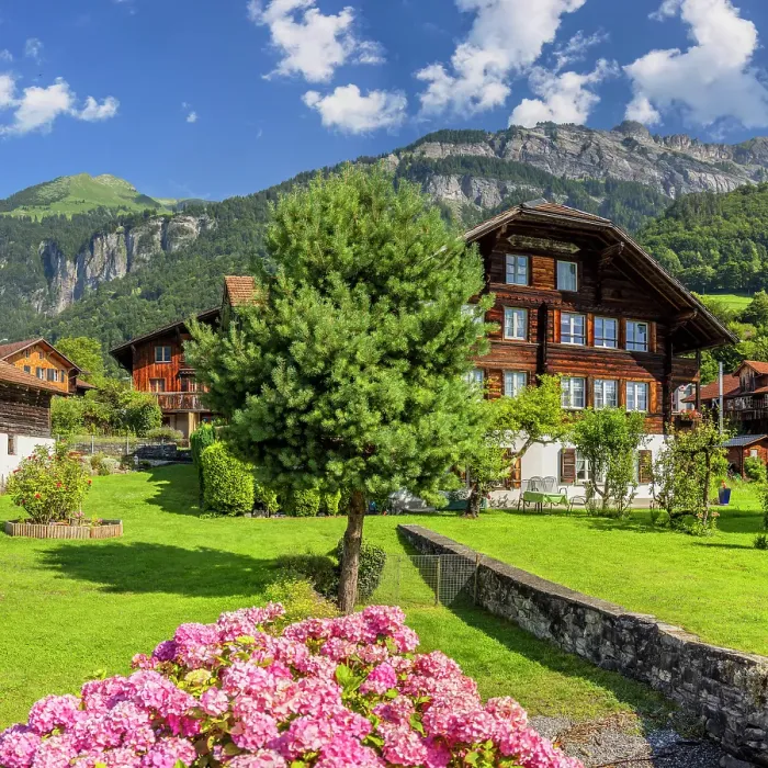 Framed Print : Traditional chalets with Brienzer Rothorn mountain, Brienz, Switzerland